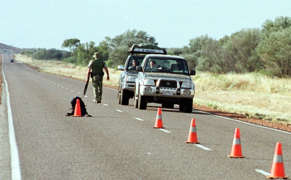 Police searching the Stuart Highway in 2001