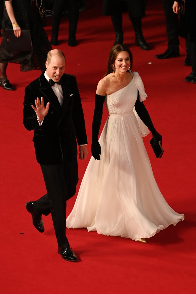 The beaming royals waved to the crowd as they made their way on the red carpet