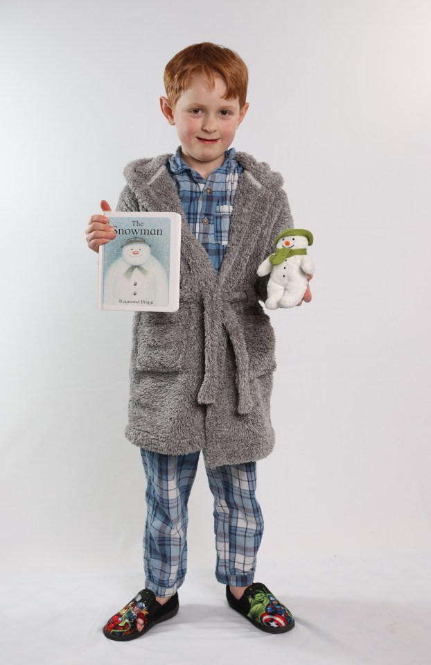 The boy has become a symbol of Christmas as he flies across the air with his frosty friend