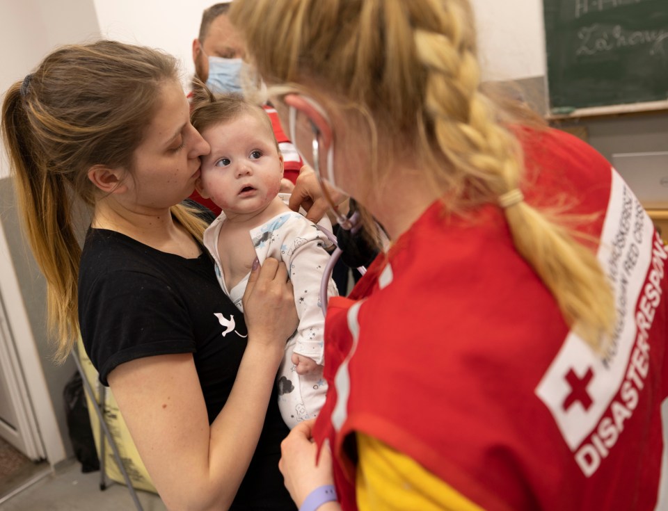 Red Cross Centre, Zahony, Hungary on March 1, 2022 - pictured Tania and her five-month-old son Alexei