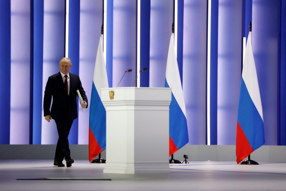 Putin walks to the lectern to deliver his speech