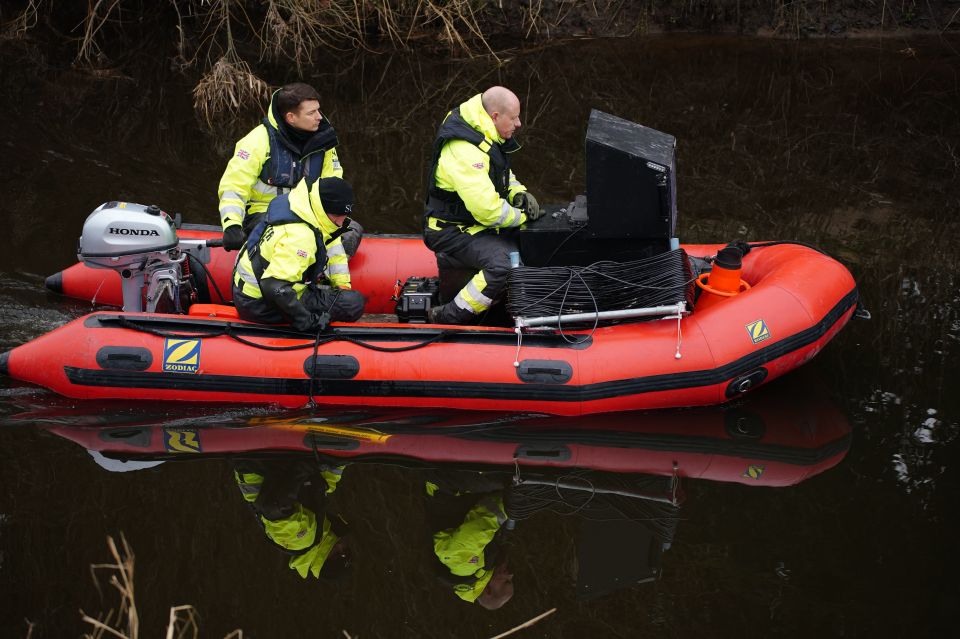 Peter Faulding, right, using underwater detection equipment