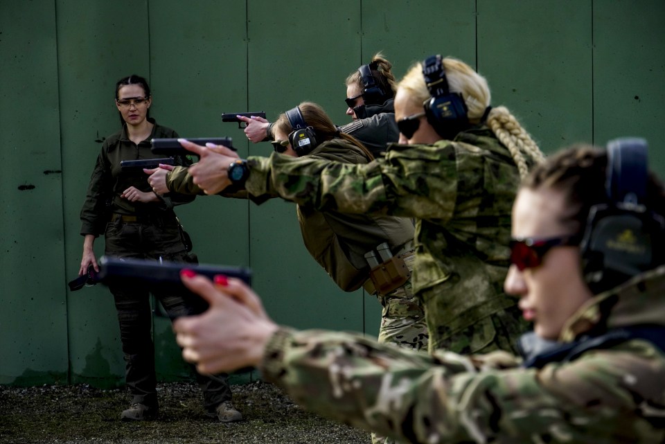 Women practise their shooting skills at the Russian Special Forces University