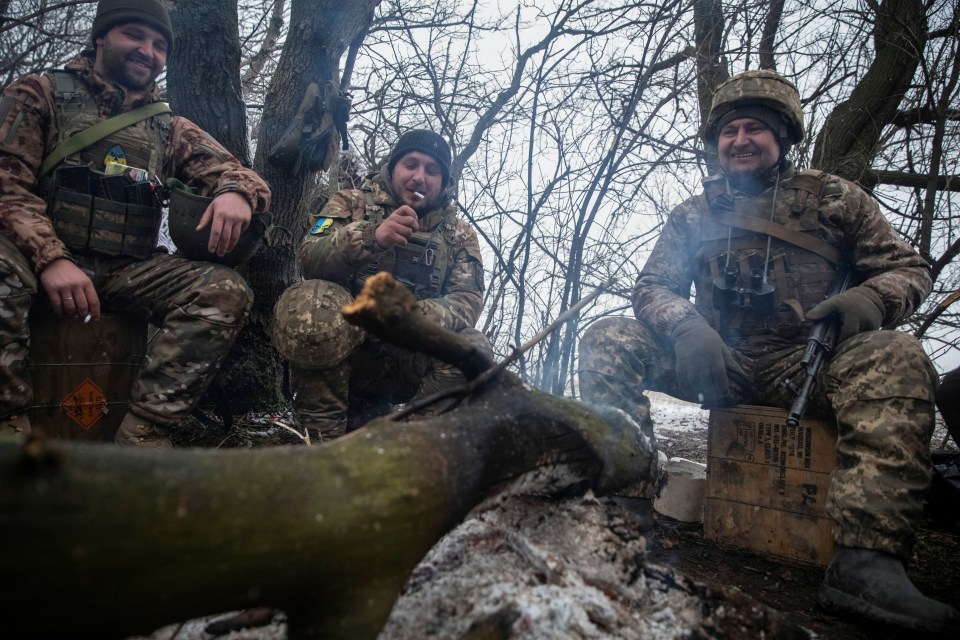 Ukrainian troops rest at their positions near a front line