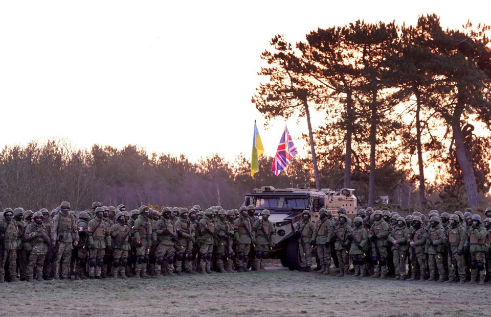 Ukrainian troops with UK military instructors commemorated a year of the war