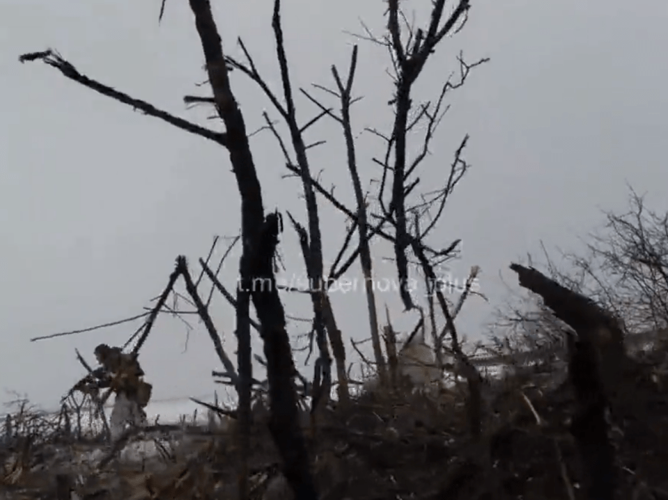 The lone Wagner Group soldier stalks across the scorched battlefield, believed to be near Bakhmut