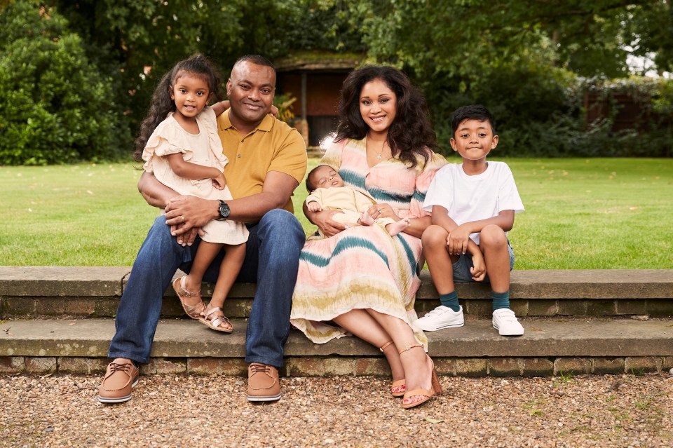 Hero dad Johnson with his wife and kids in 2021