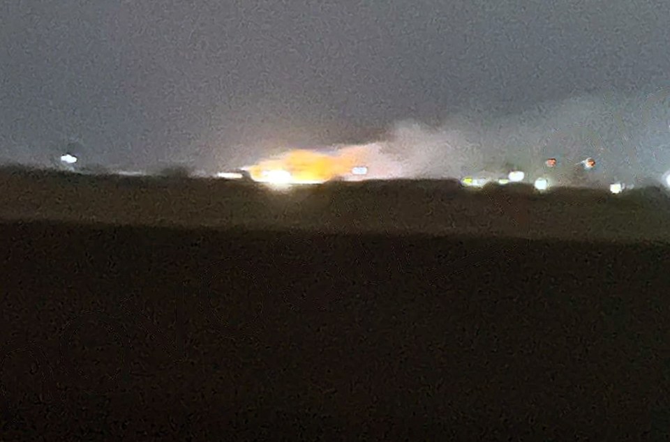 Black smoke seen billowing from a Russian airbase just after the invasion's anniversary