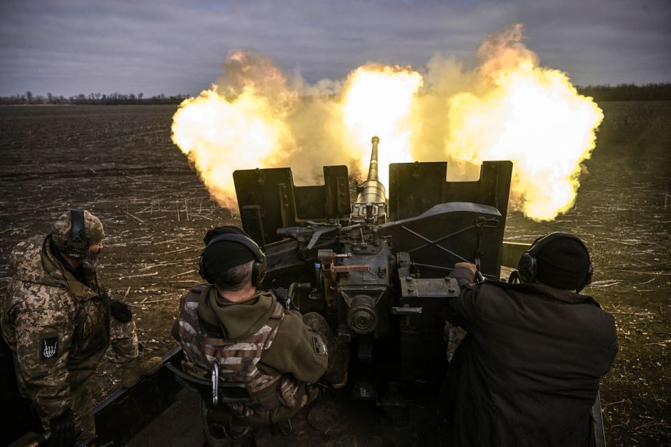 Ukrainian servicemen fire an antitank gun near Bakhmut