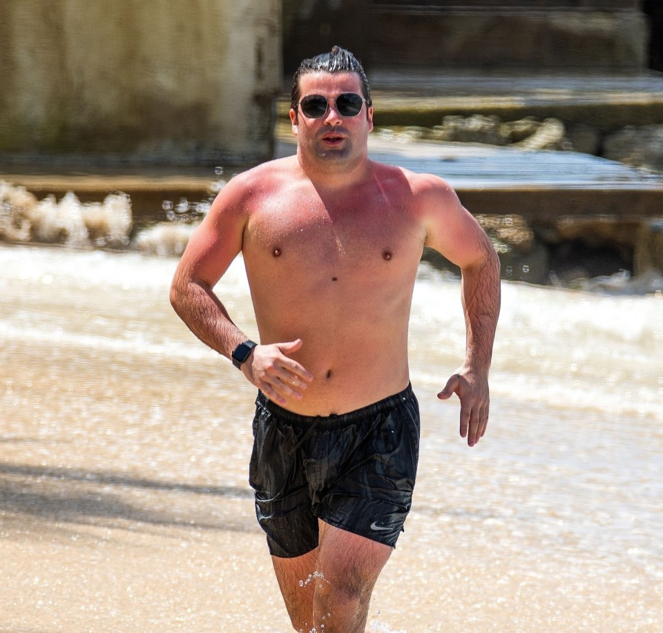 Joe, 31, sprints across the sand as he reveals his edgier look 14 years after finding fame