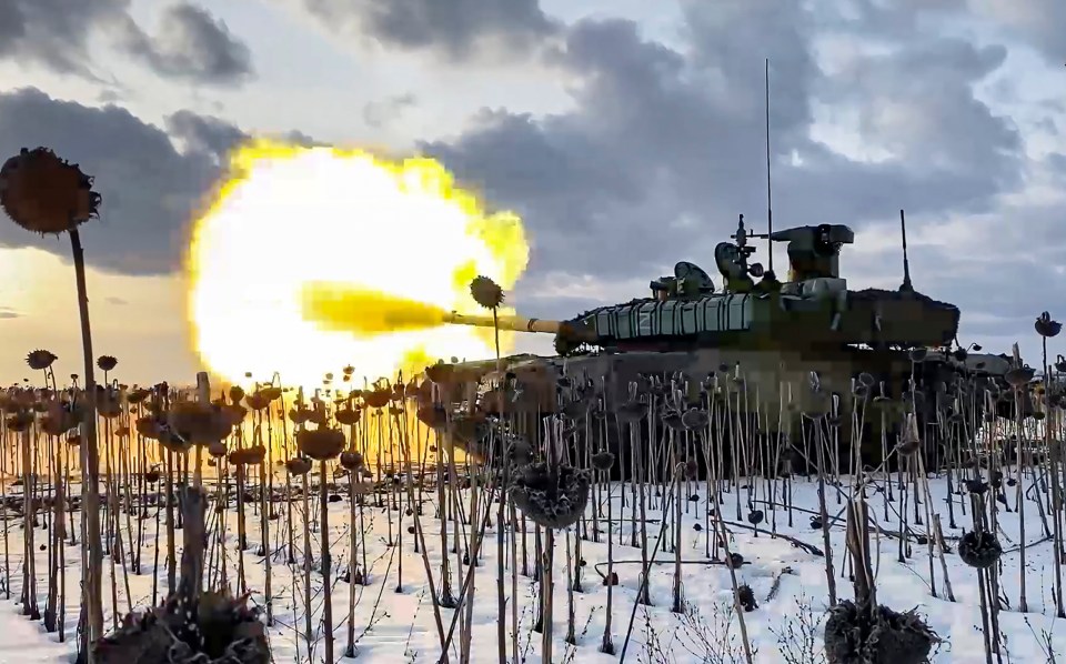 A Russian T-90 battle tank fires a shell in the Donetsk