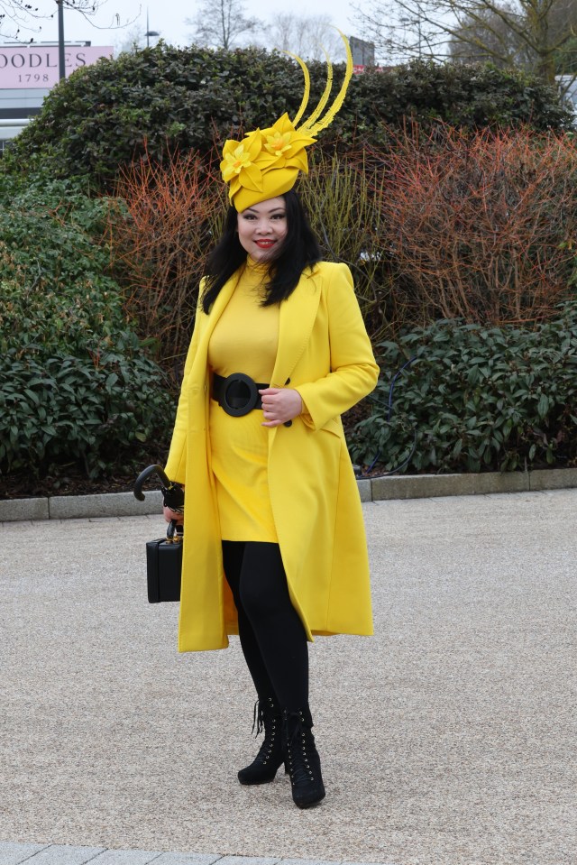 This racegoer shone in a yellow ensemble and dramatic, matching fascinator