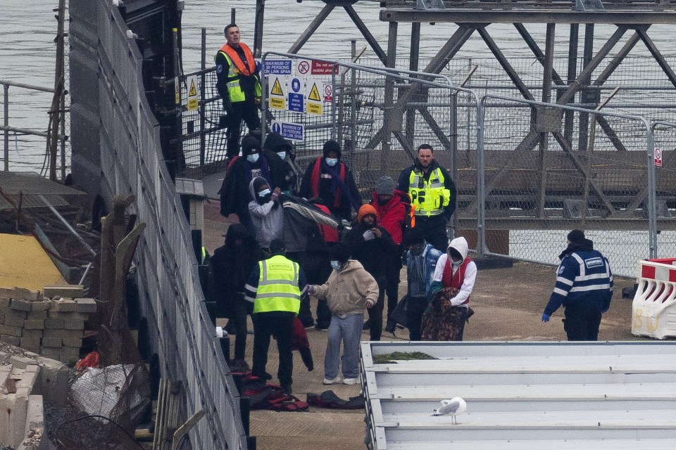 Illegall migrants are pictured arriving in Dover after being picked up in the Channel