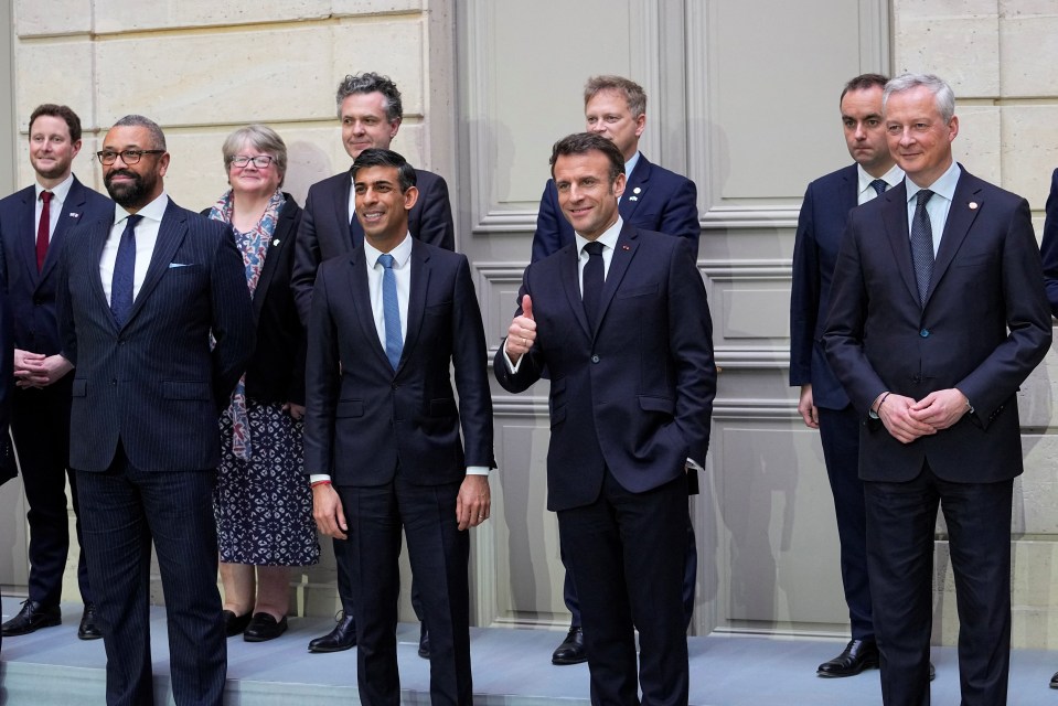 British and French ministers pose for a family photo in the Elysee Palace