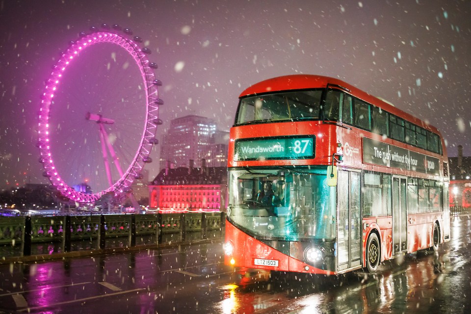 Snow falling at sunrise in central London this morning