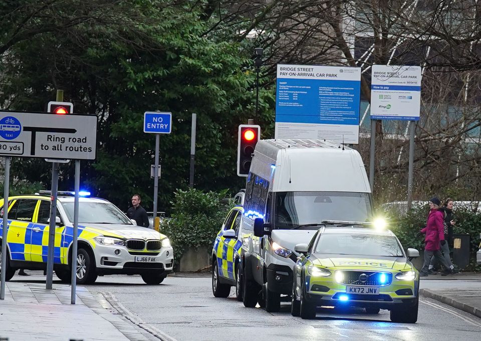 A van arrives under police escort