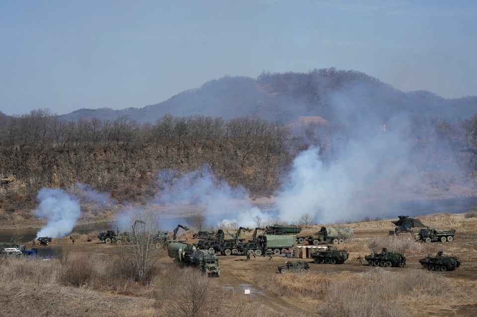 US Army vehicles prepare to cross the Hantan river at a training field in Yeoncheon, near the border with North Korea