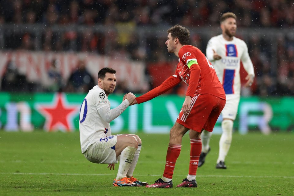 Muller helps a dejected Messi up last night