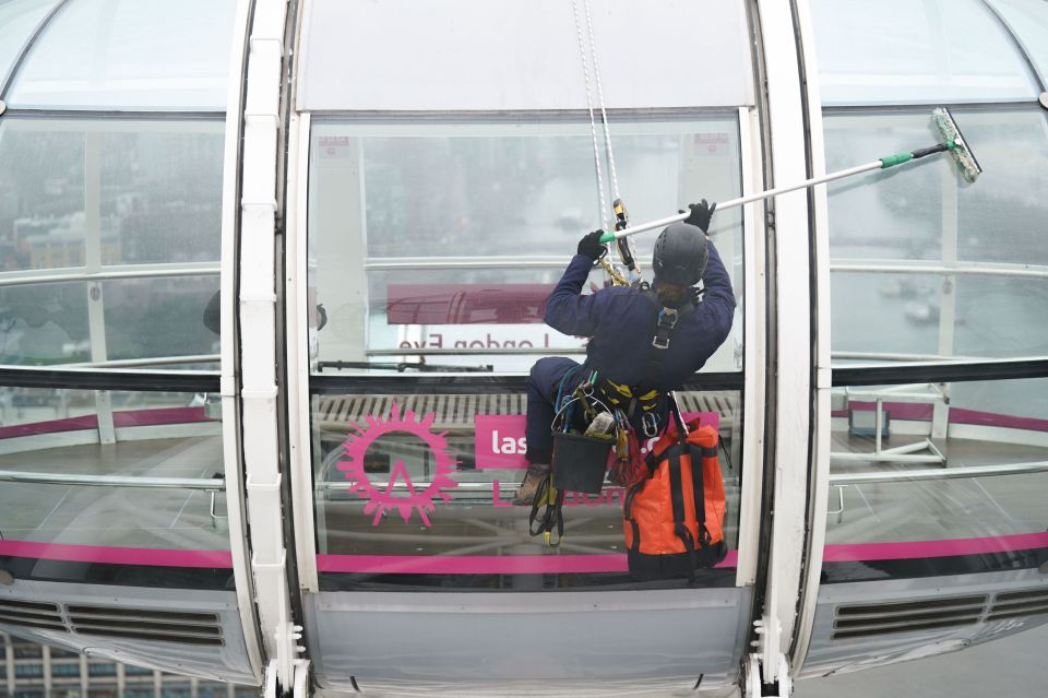 Pictures of the cleaners show them suspended in the air against the backdrop of Big Ben