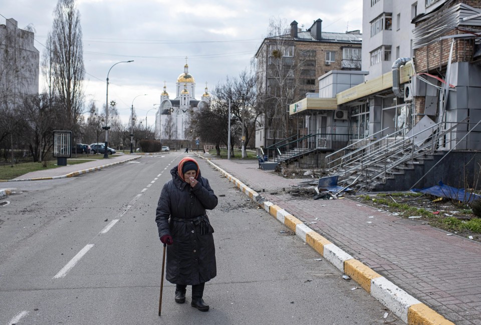 An elderly woman cries in the street in the days after Russian forces retreated in Bucha