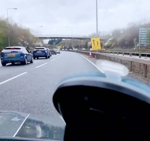 Driver overtakes queue of cars held up by roadworks