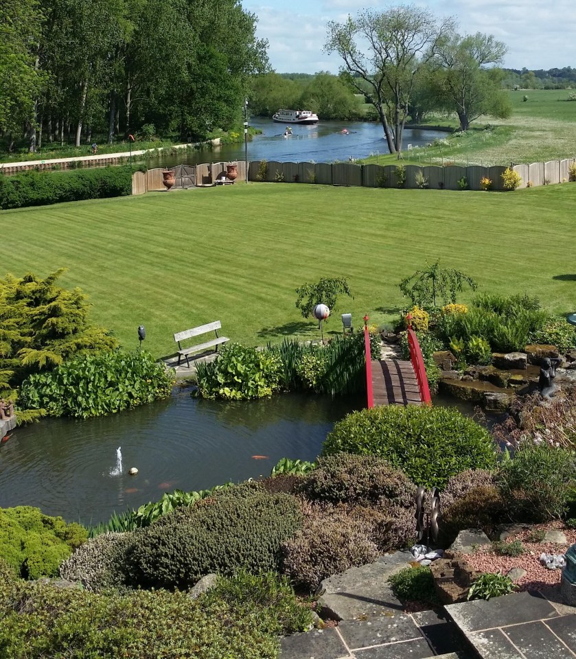 Outside, a Japanese water garden features a koi pond, traditional Japanese bridge and three interlinked ponds as well as a 6ft natural waterfall