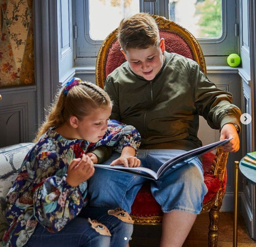 They shared a snap of Arthur and Dorothy reading Adventures at the Chateau, their own family book in their library room