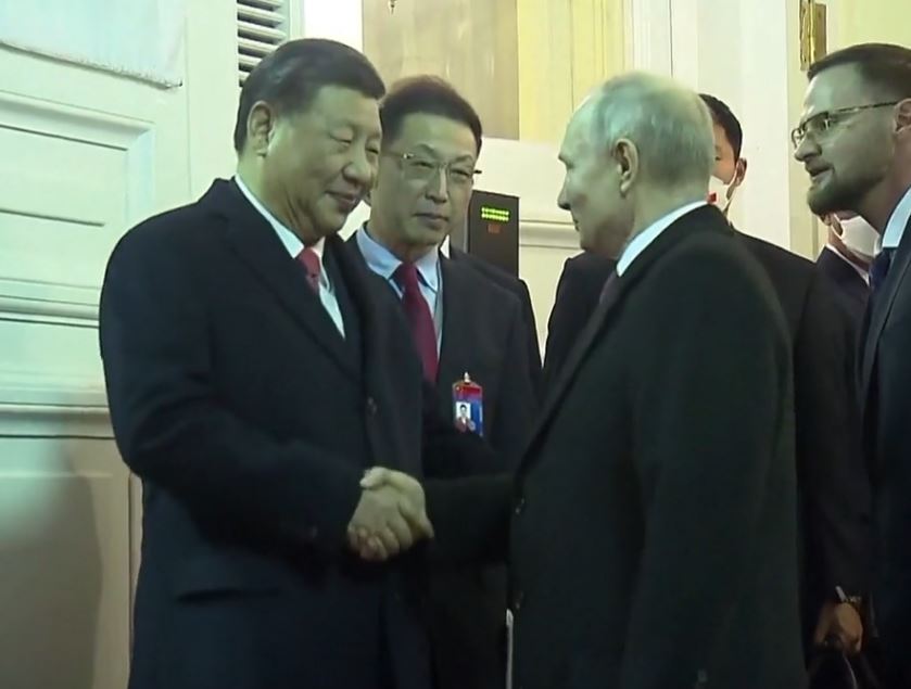 Xi and Putin shook hands as they said farewell after the two-day visit