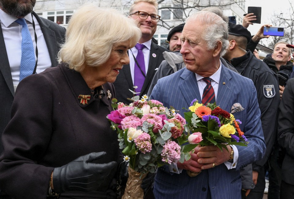 King Charles and Camilla were handed bouquets of flowers