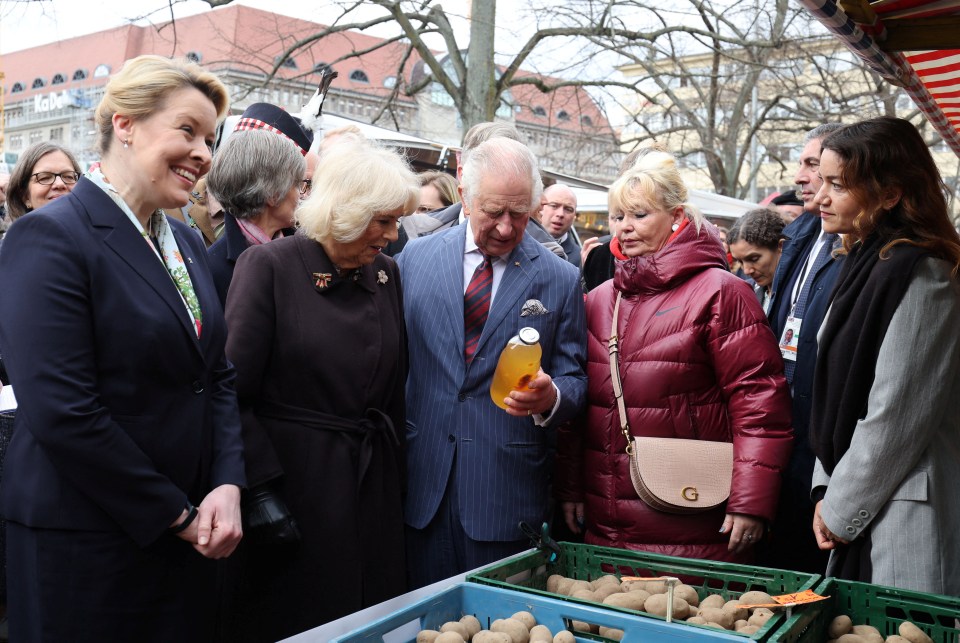 King Charles and Camilla inspected a bottle of apple juice