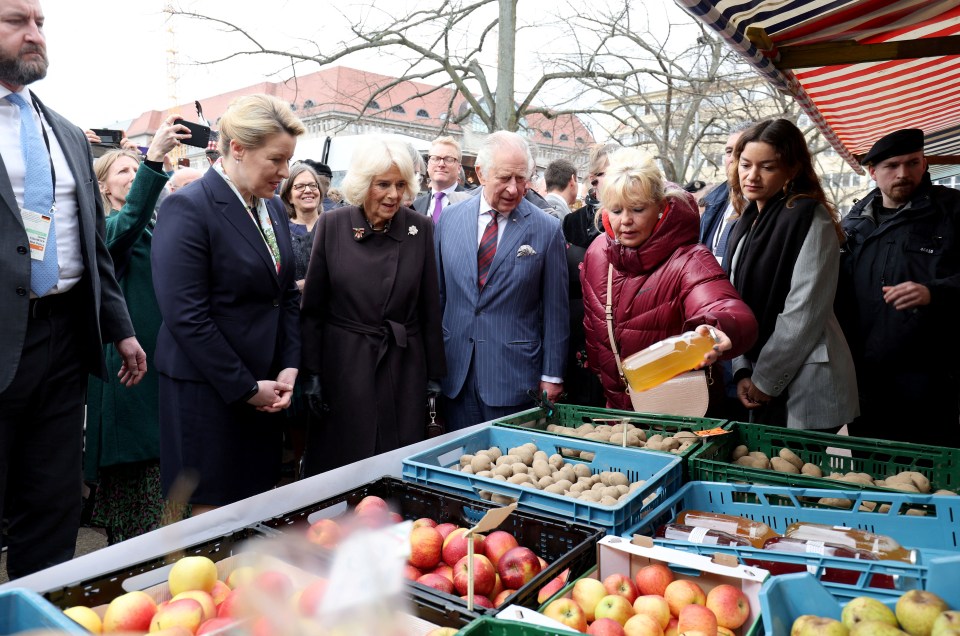 King Charles was shown a bottle of juice at Wittenbergplatz Food Market in Berlin