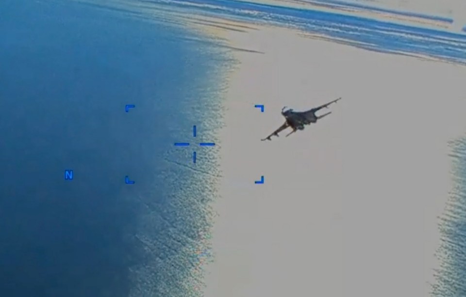 The familiar sight of a Russian Su-27 performing dangerous manoeuvres near a US aircraft