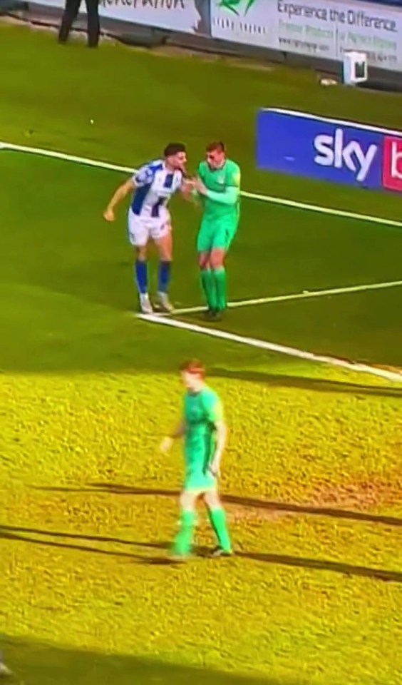 Colchester's Connor Hall appeared to have punched Tranmere's Tom Davies