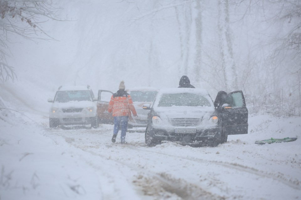 Cars stuck in heavy snow on Lydeard Hill near Cothelstone, Somerset