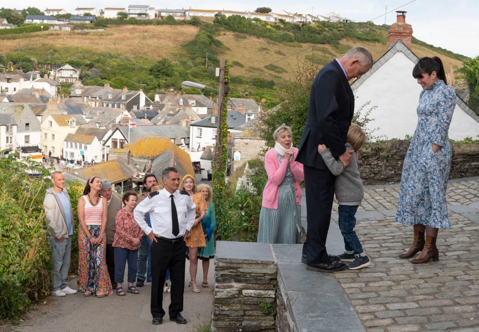 The cast includes John Marquez as PC Penhale, Selina Cadell as Mrs Tishell, Martin Clunes as Doc Martin, Elliott Blake as James and Caroline Catz as Louisa Ellingham