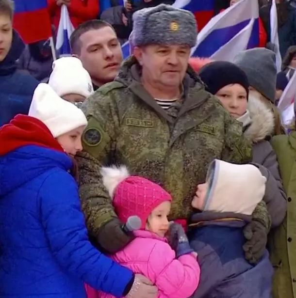 Deported Ukrainian children were sent hugging their kidnappers in a ‘staged’ performance at a Moscow pro-war rally