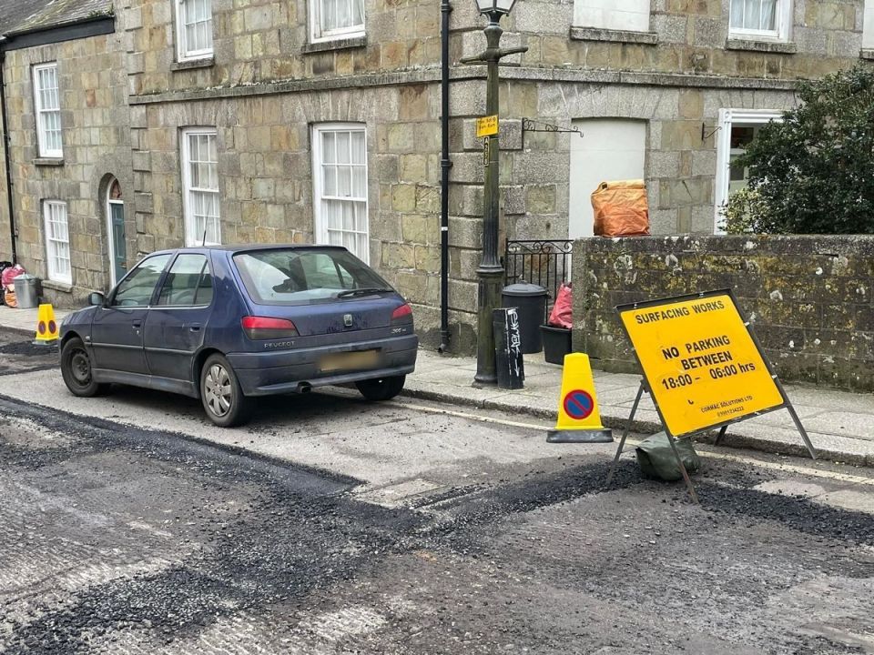 Another car was stuck after apparently ignoring the 'no parking' sign