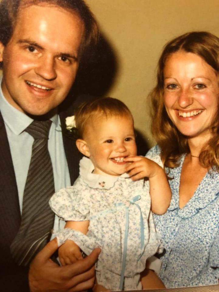 Little charmer Debs as a smiley baby with her parents Alistair and Heather