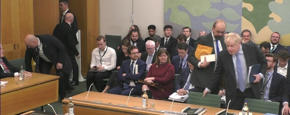 Boris Johnson enters the Commons committee room to begin the hearing