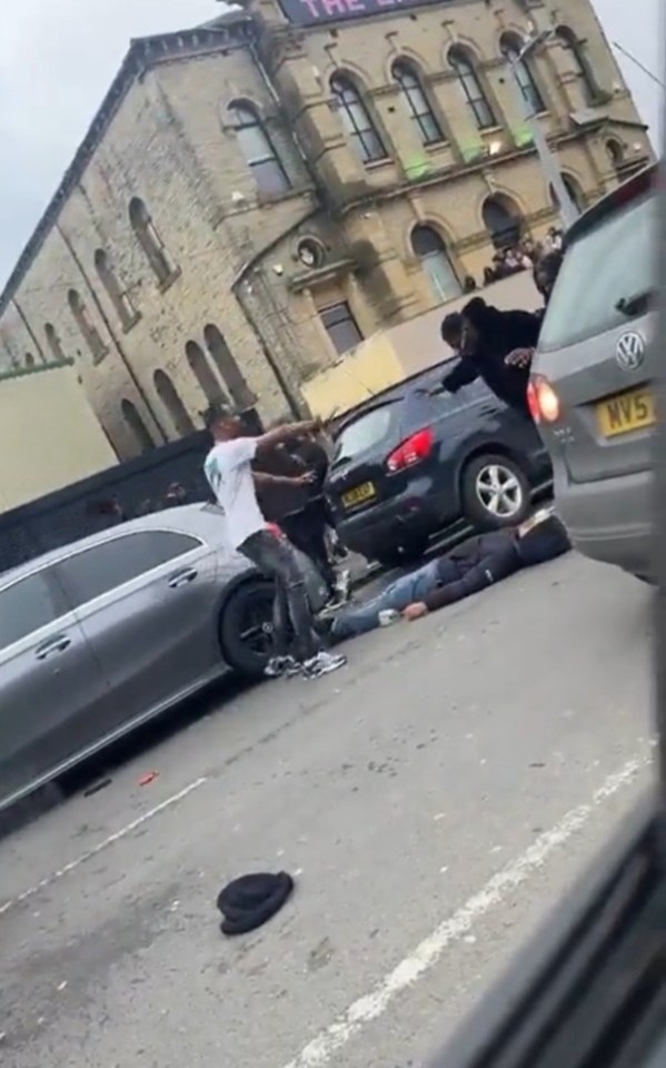 One man is seen knocked out unconscious in the brawl