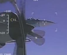 Footage taken from a US Navy EP-3 Aries spy plane shows a Russian Su-27 come into view