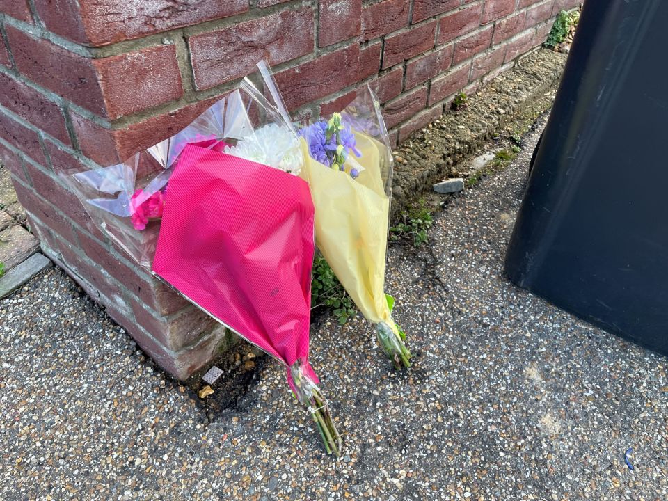 Floral tributes were left at the scene in Sutton following last night's horror