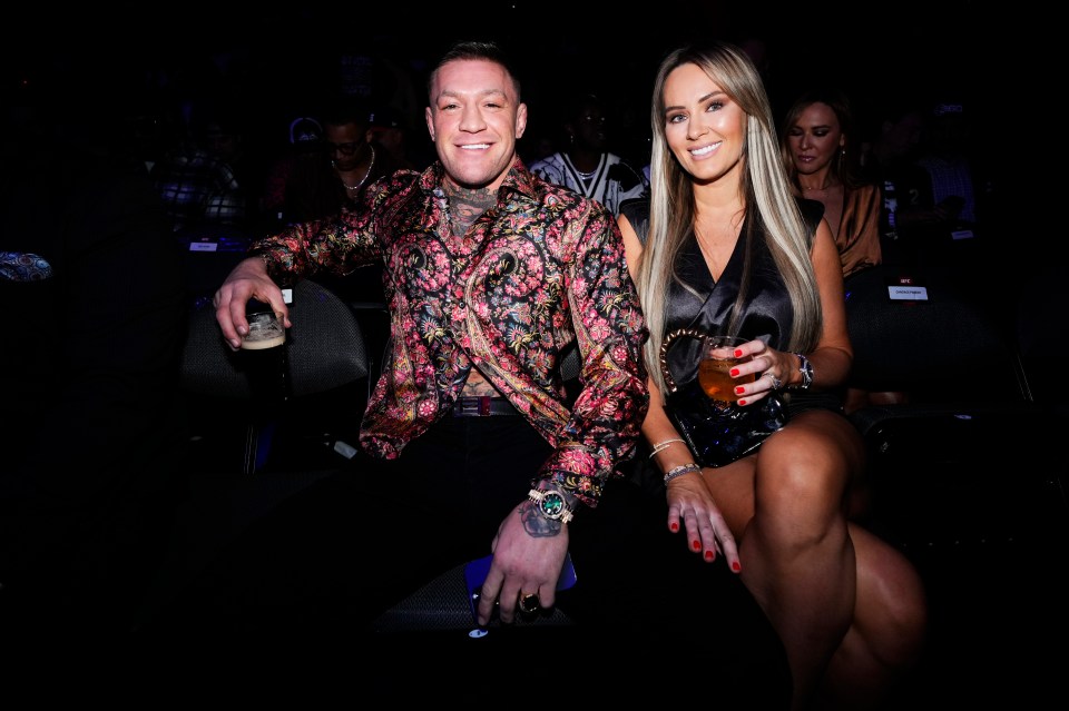 McGregor and Dee certainly relaxed as they watched on at the  T-Mobile Arena in Nevada, Las Vegas