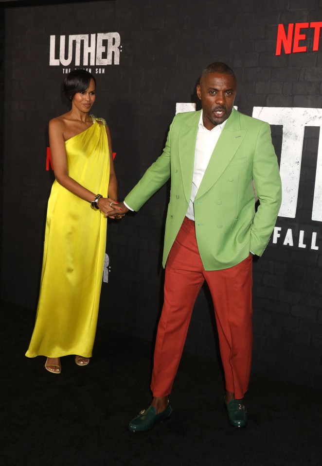 Idris, 50, wore red trousers and a green blazer while Sabrina wore a yellow gown