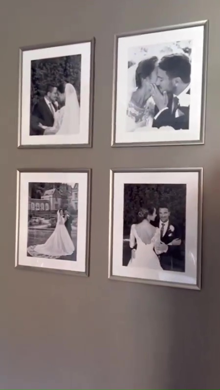 Emily proudly displayed gorgeous snaps from their wedding day on their bedroom wall