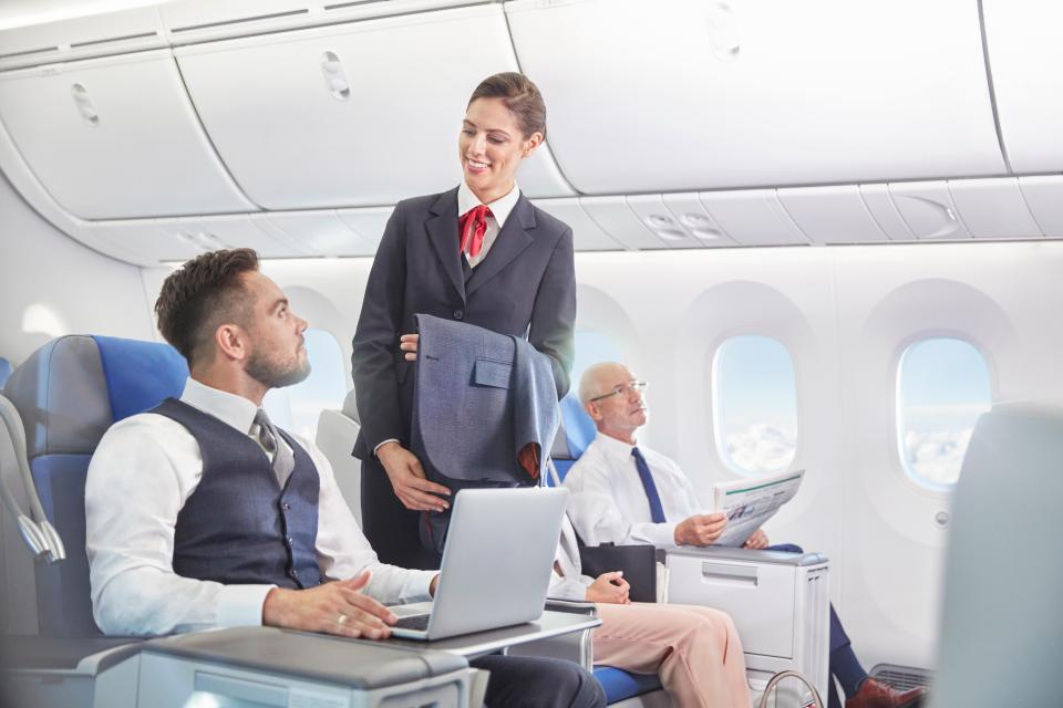 A flight attendant has revealed why giving passengers a free seat upgrade could get fired (stock image)