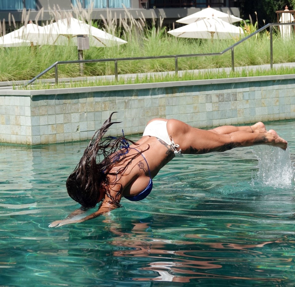 Katie took a dive in the pool after recovering from surgery