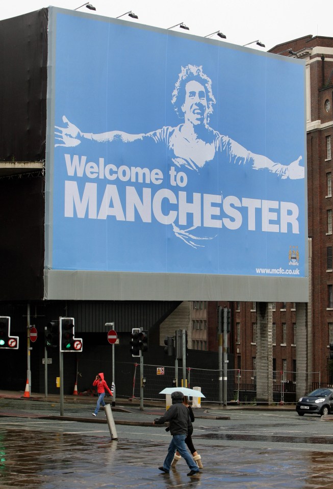 Carlos Tevez appears in City's infamous 'Welcome to Manchester' billboard