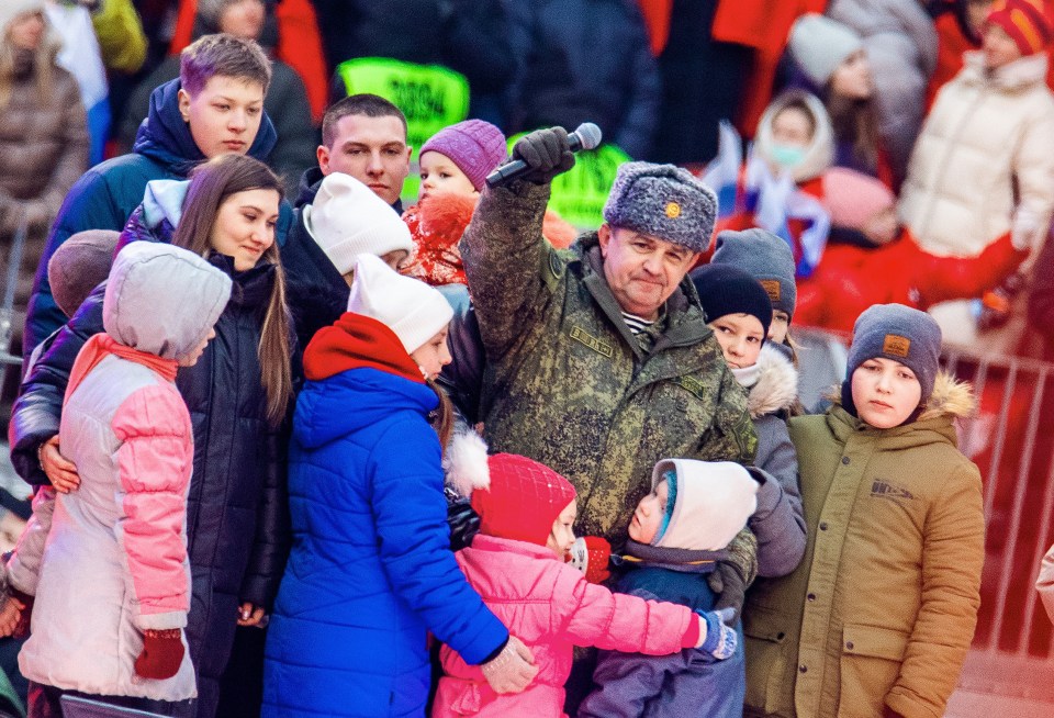 Children believed to have been abducted from Ukraine appeared on a stage with soldiers in Moscow