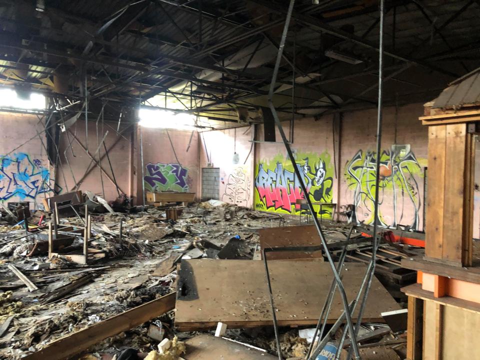 The former bar area has been left to rot with pool tables overturned